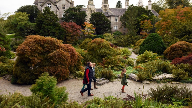Visitors walking through the rock garden at Sizergh, Cumbria